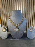 White Monalisa stone and moissanite pendant necklace set with floral motifs, a teardrop pendant and matching earrings