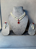 Pearl necklace set with red stone pendant and matching earrings